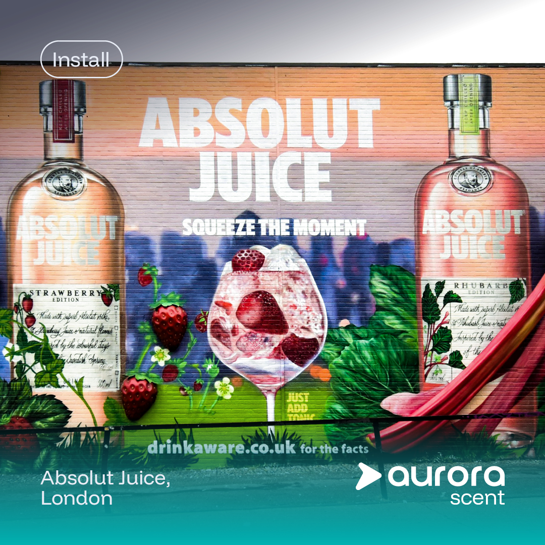 brick wall painting mural in London featuring Absolute Juice branding.