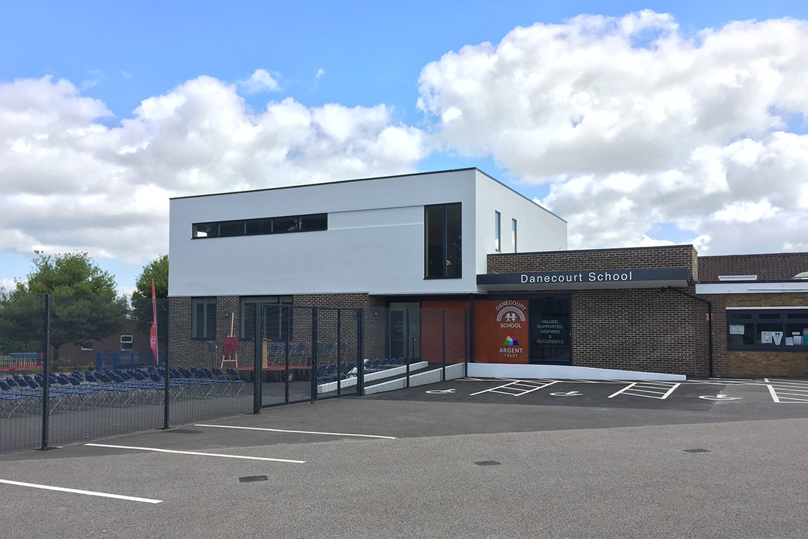 Modern school building labeled 